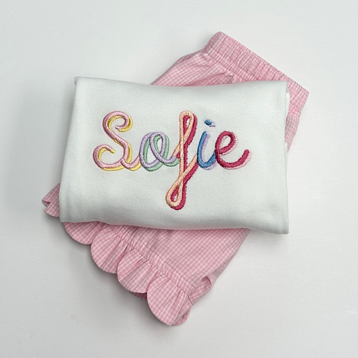 Girls Rainbow Cursive Name Ruffle Tee – Queen of Threads Monogramming